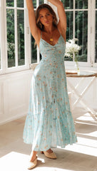Blaues, rückenfreies Kleid mit Blumenmuster und Knopfleiste