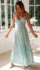 Blaues, rückenfreies Kleid mit Blumenmuster und Knopfleiste