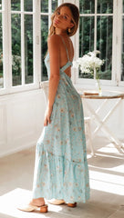 Blaues, rückenfreies Kleid mit Blumenmuster und Knopfleiste