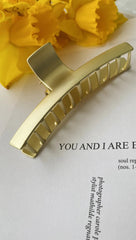 Goldene Haarklammer