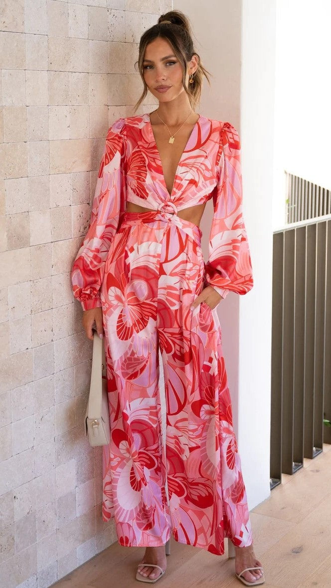 Rosa Jumpsuit mit Blumenmuster und Cut-Out-Taille