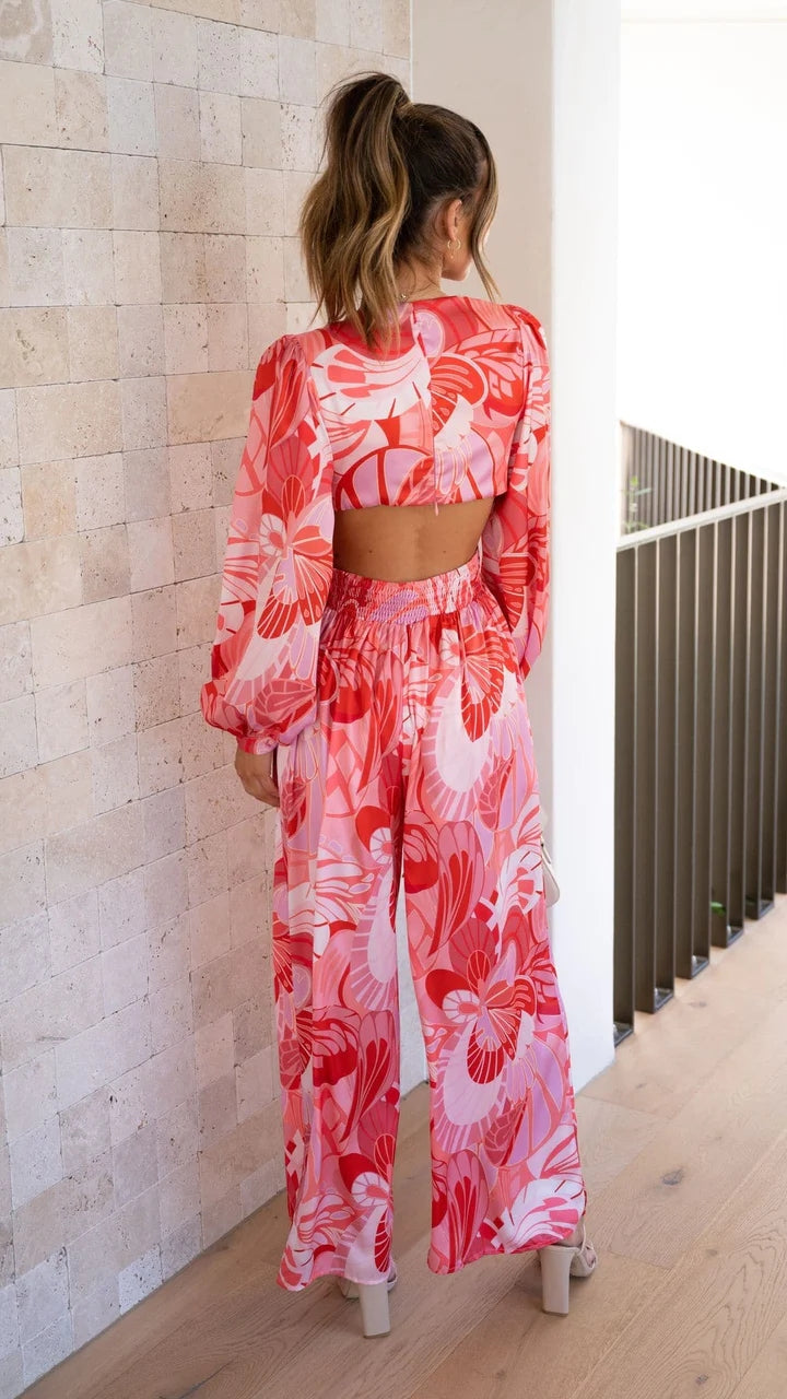 Rosa Jumpsuit mit Blumenmuster und Cut-Out-Taille