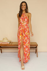 Oranges, rückenfreies Kleid mit Blumenmuster und hohem Schlitz